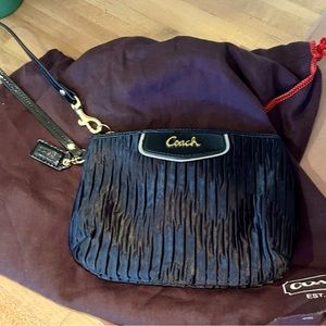 Coach wristlet in black, new without tags, 5 in by 7 in